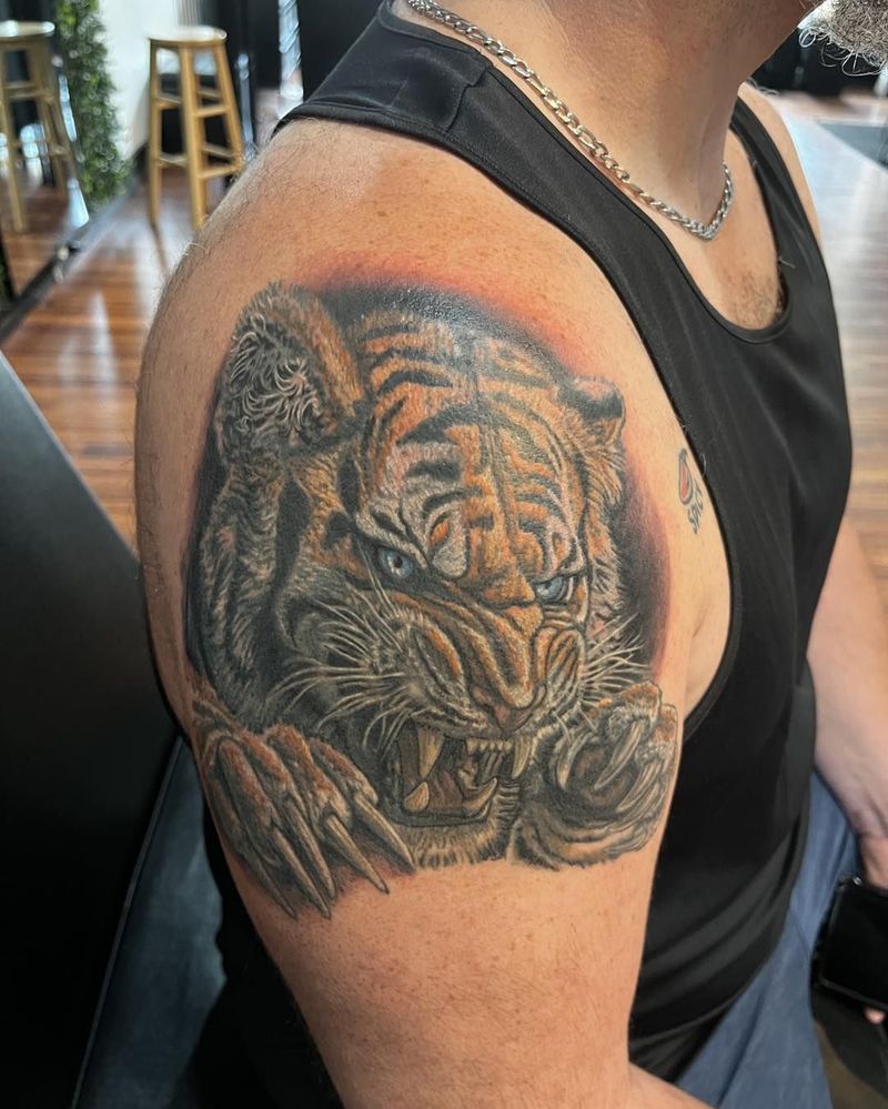 Color realism tiger tattoo on an upper arm